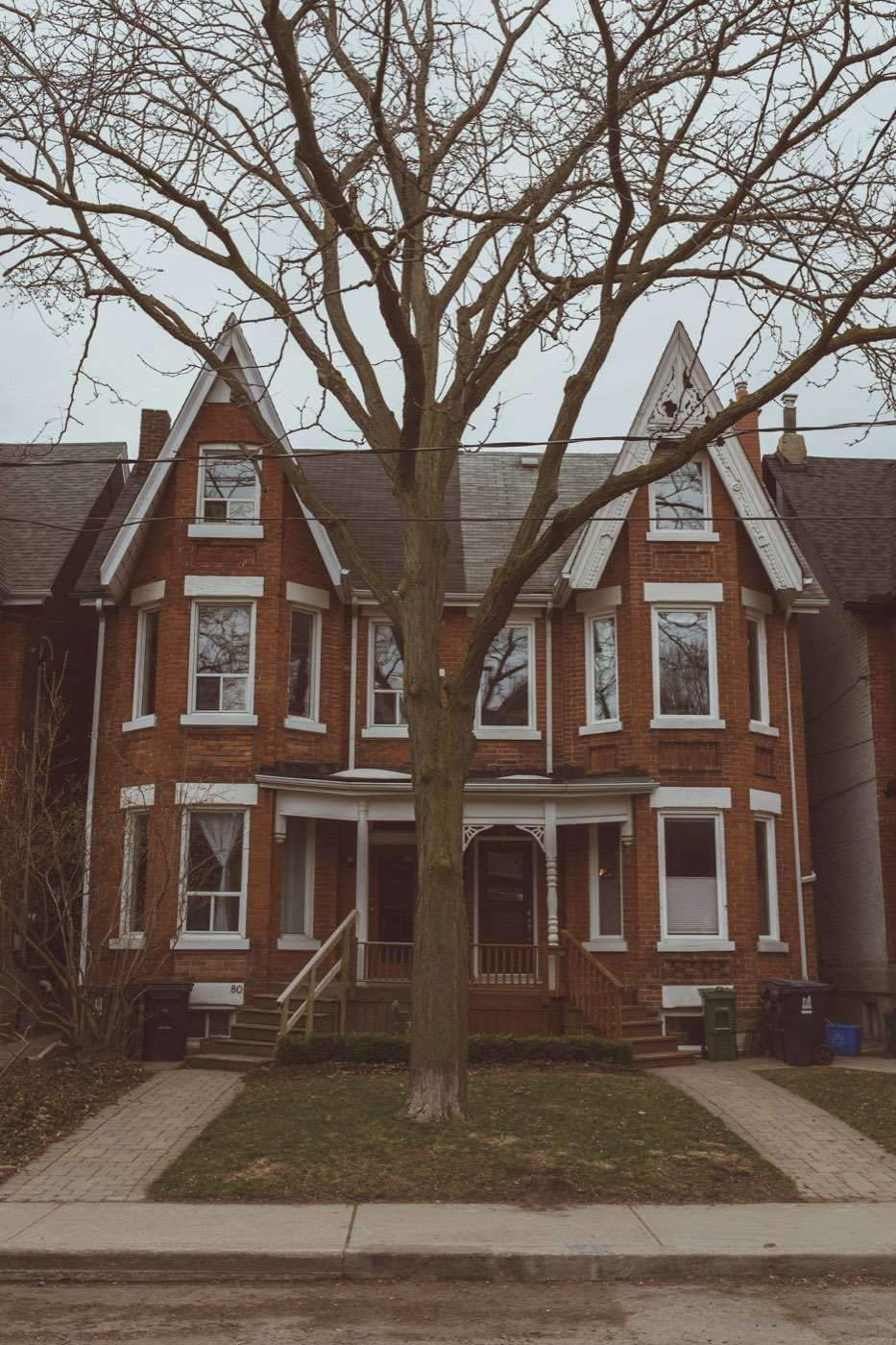 Victorian red-brick Toronto house with a steep roof